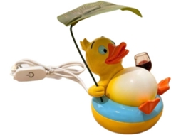 Luminária de mesa em formato de pato: divertida, com folhas decorativas, ideal para mesas.