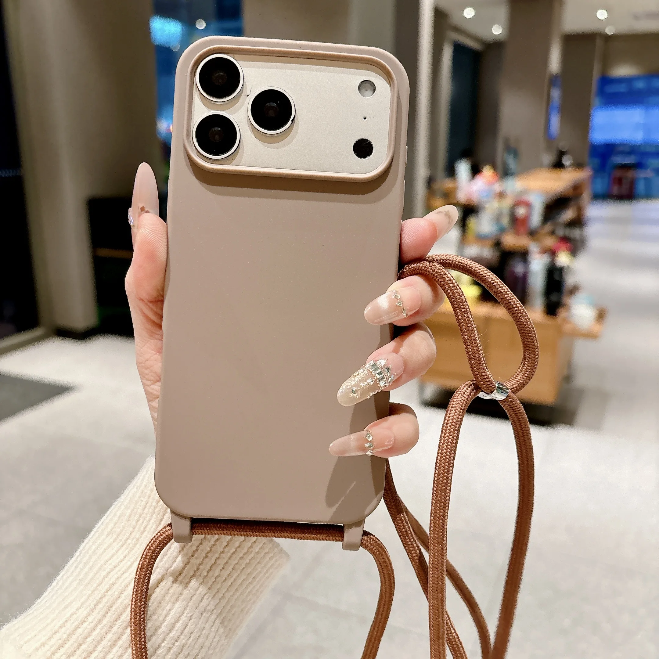 Capa De Silicone Macio Para Iphone 16e (cor Café) Com Alça Transversal Ajustável.
