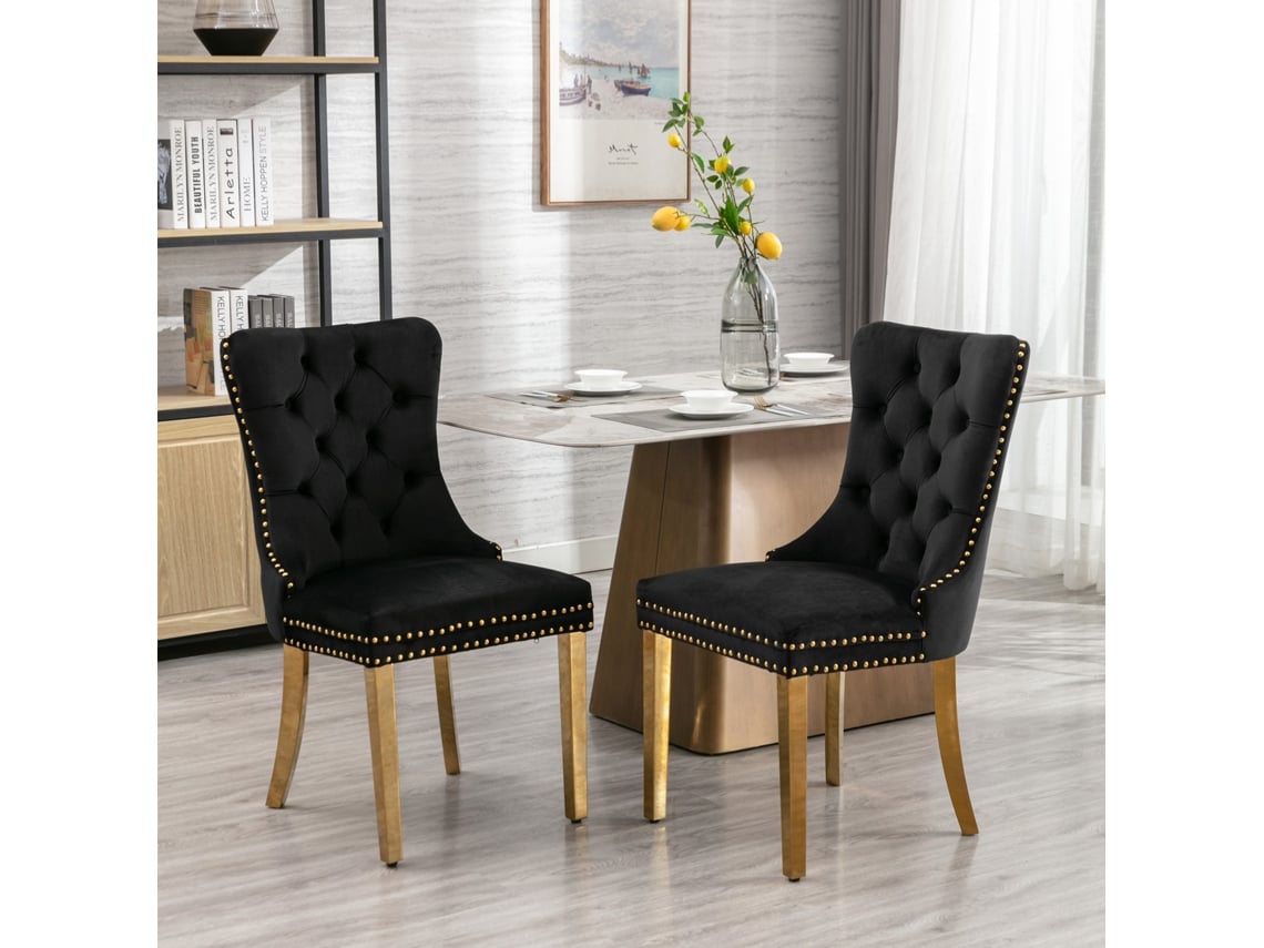 Juego de 2 sillas de comedor tapizadas en terciopelo con patas de acero inoxidable dorado y detalles de tachuelas. Color: Negro y dorado.