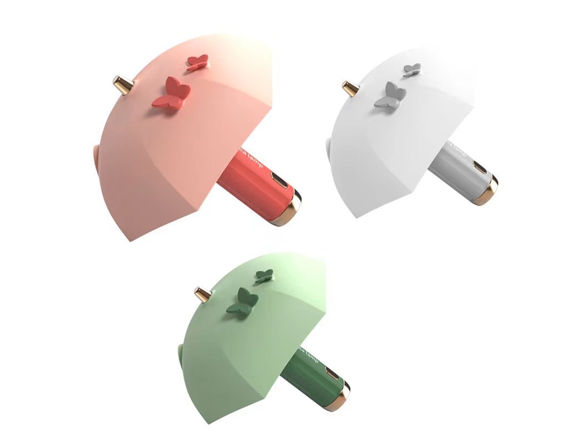 Três Guarda-chuvas Estilosos Em Cores Diferentes. Mini Leitor Inteligente De Led