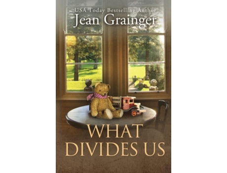 Livro What Divides Us The Kilteegan Bridge Story - Book 2 de Jean Grainger (Inglês - Capa Dura)