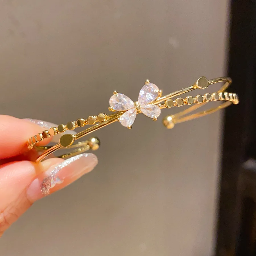 Pulseira Aberta Em Forma De Laço Com Zircônias Cúbicas (dourada), Um Presente Brilhante Perfeito Para Festas.