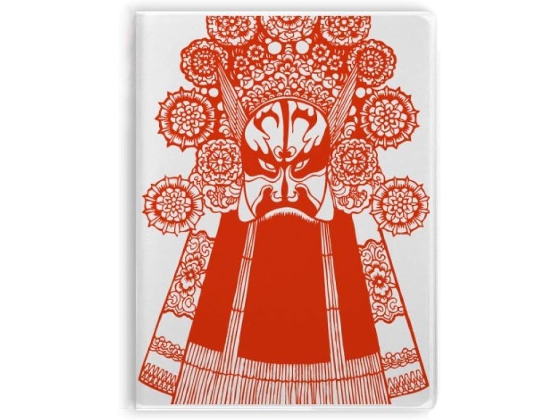 Caderno vermelho de ópera com capa estampada com desenho de rosto e sopa.