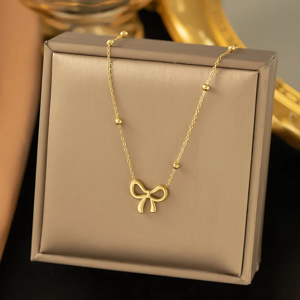 Conjunto De Colar E Pulseira Com Pingente De Laço Em Aço Inoxidável