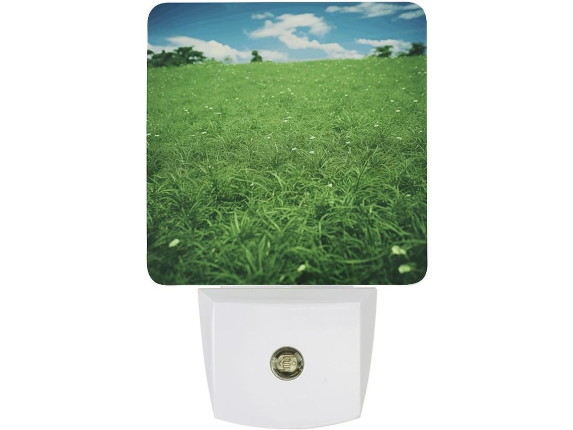 Luminária de parede LED noturna com acionamento automático, sensor crepuscular e design de grama verde, ideal para uso noturno.