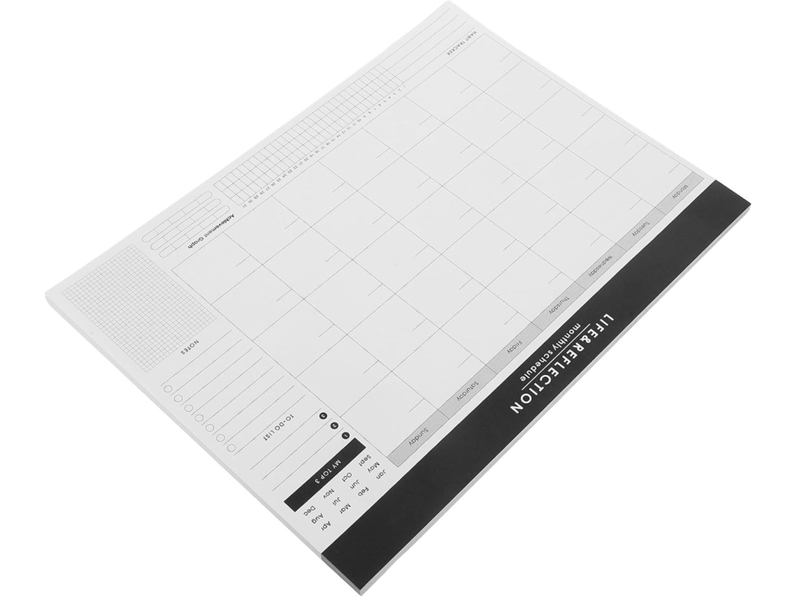 Agenda mensal em papel branco, sem data, ideal para organização pessoal.