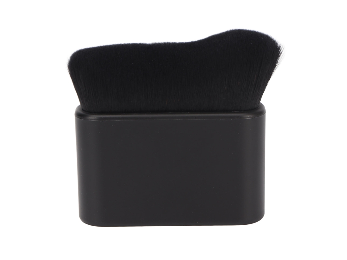 Pincel grande e plano preto para autobronzeamento.