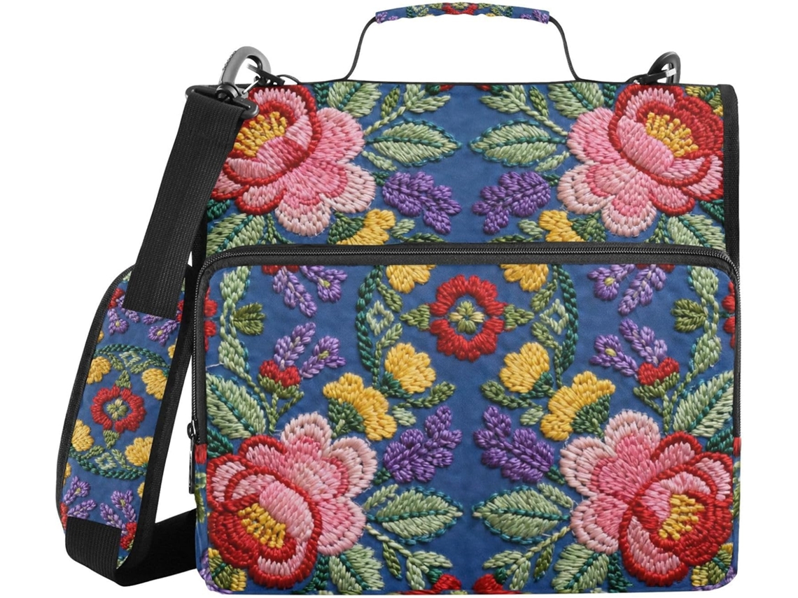 Carteira de 3,8 cm com 3 argolas, fundo azul escuro com bordado floral, alça de ombro removível inclusa.